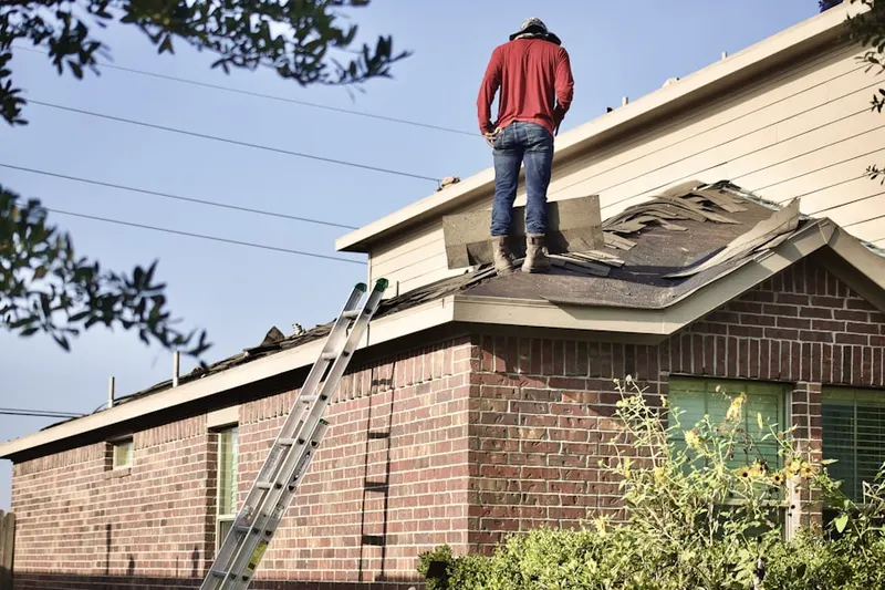 Professional roofer working on a residential roof in Williams Park